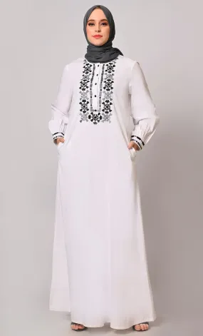 Embroidered Opulence: White Abaya with Practical Pockets